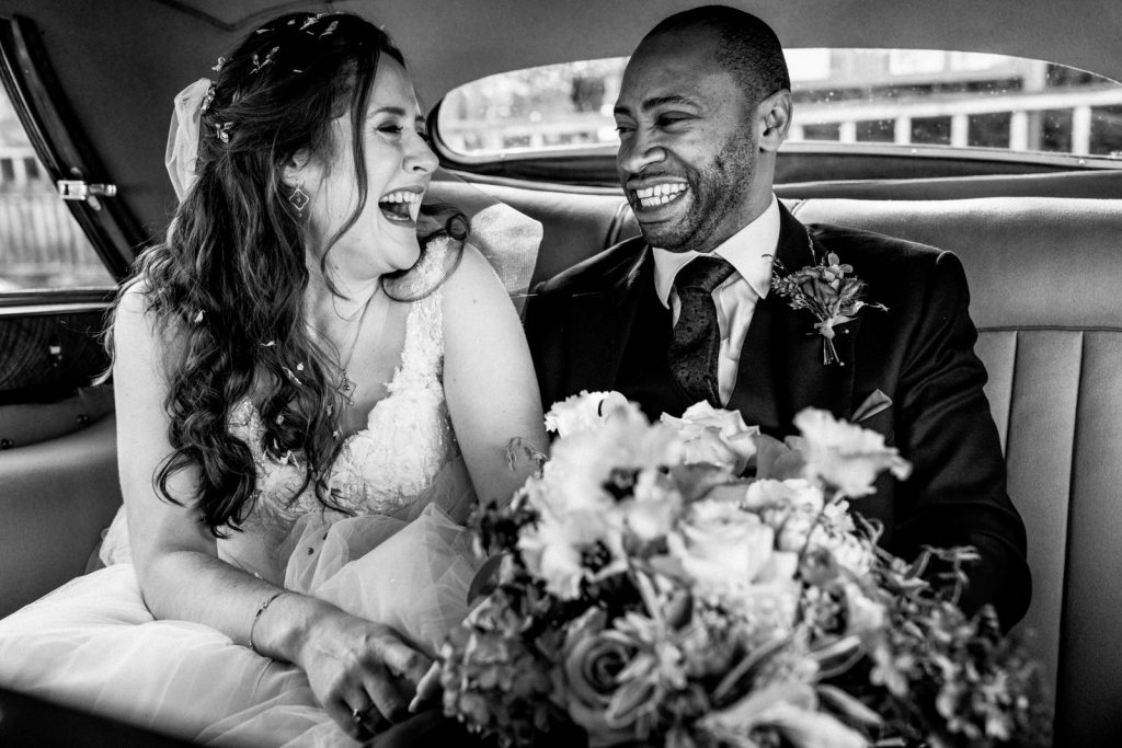 bride and groom arriving at hedsor house wedding in car