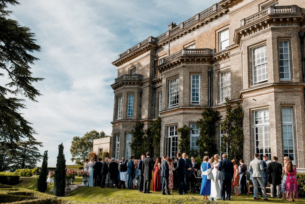 wedding guests in garden at hedsor house