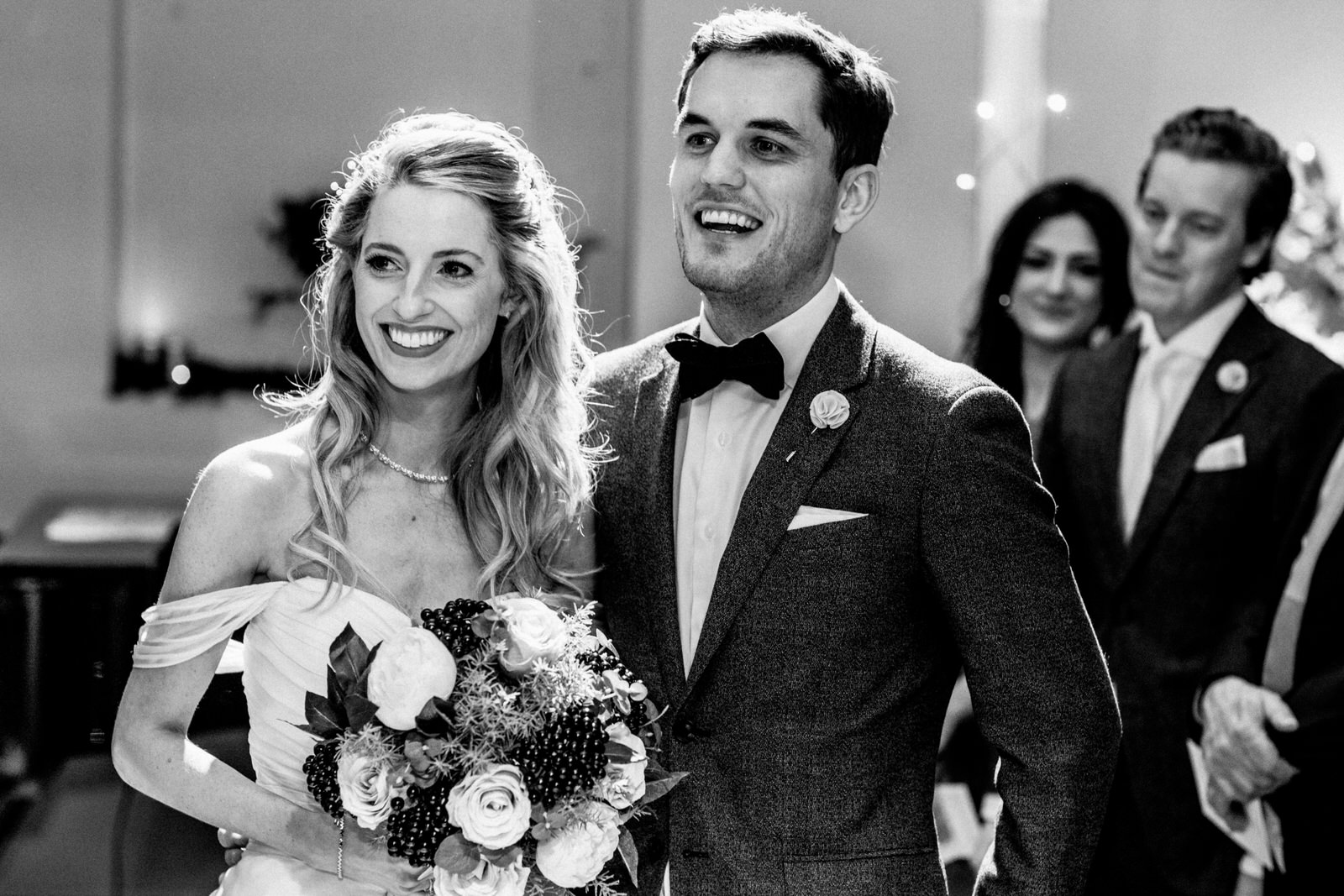 bride and groom listening to readings