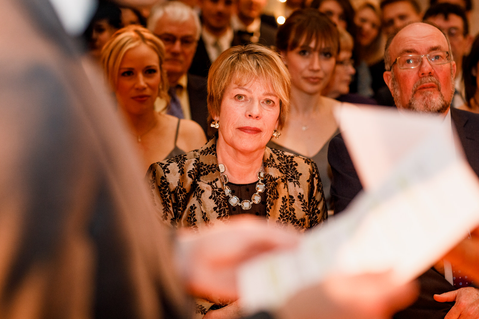 mum looking on at wedding vows