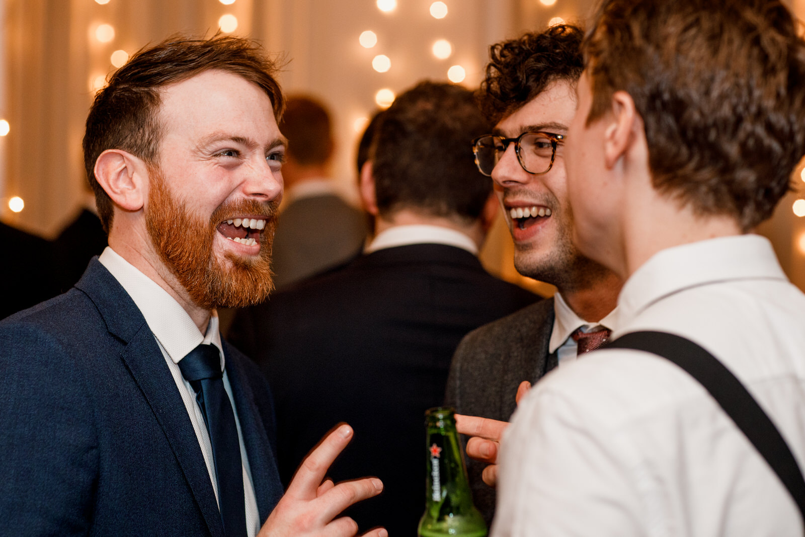 guests laughing at wedding reception