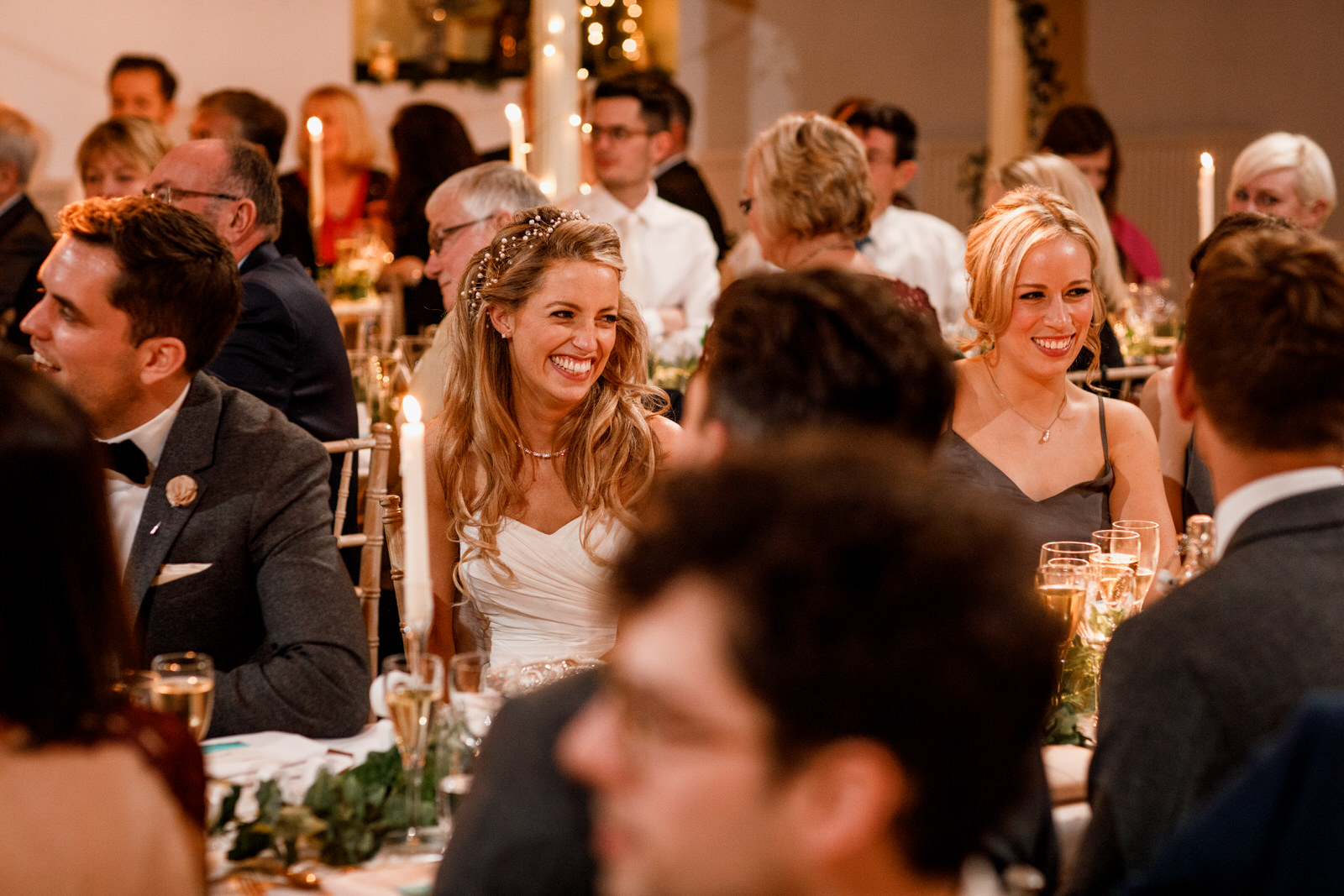 bride laughing at wedding speeches