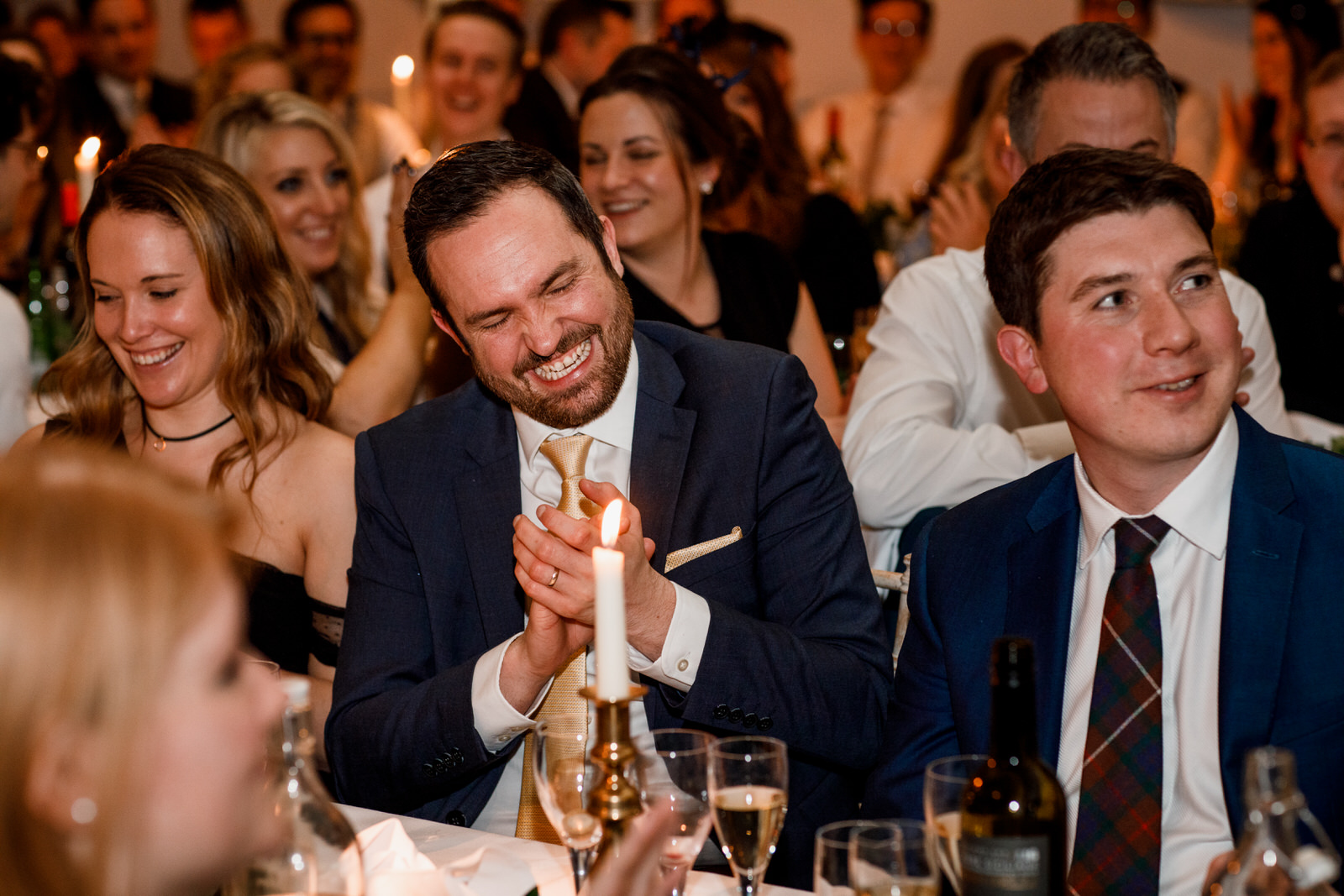 guests laughing at london wedding speech