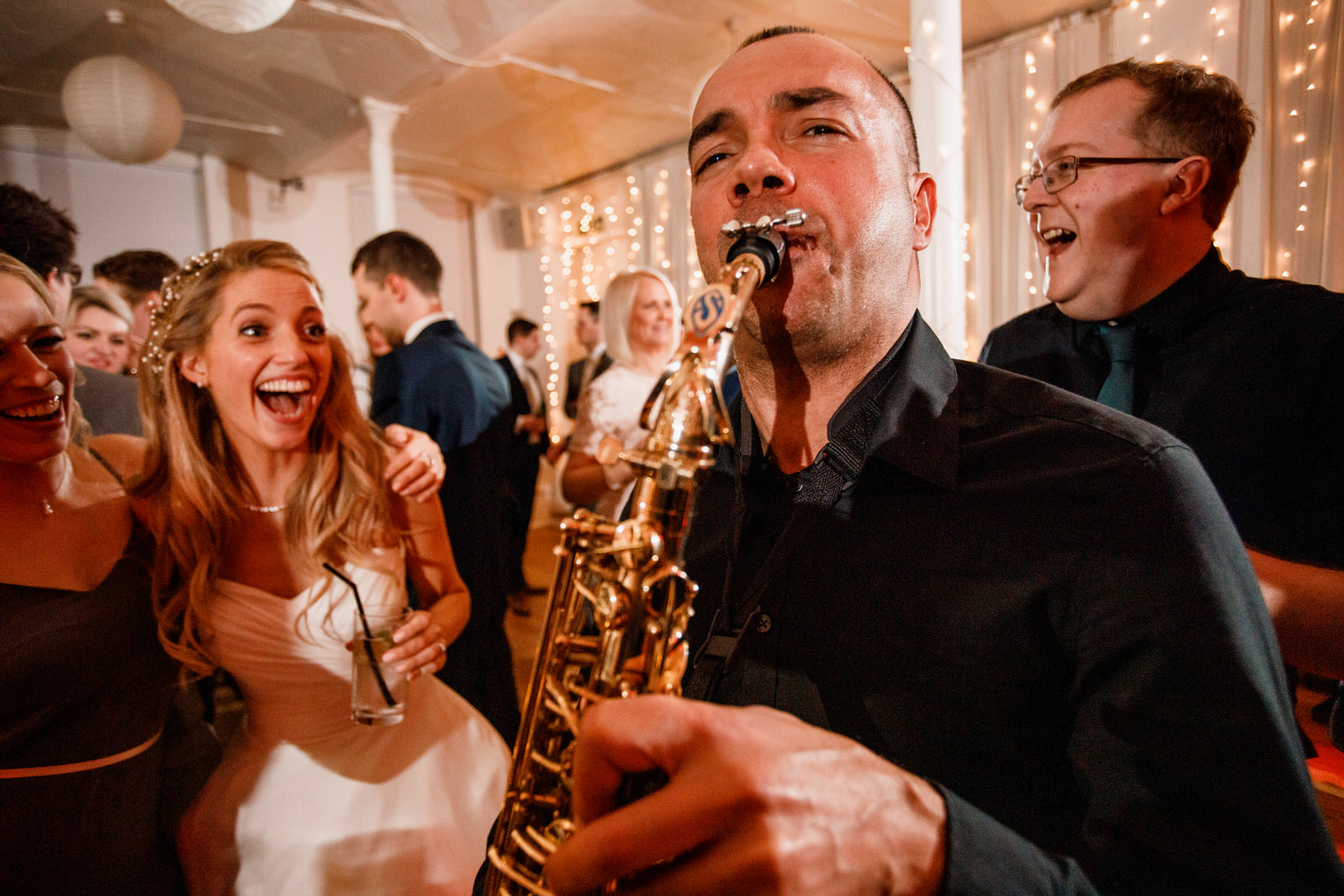 band playing saxophone while bride looks on at the amadeus, london