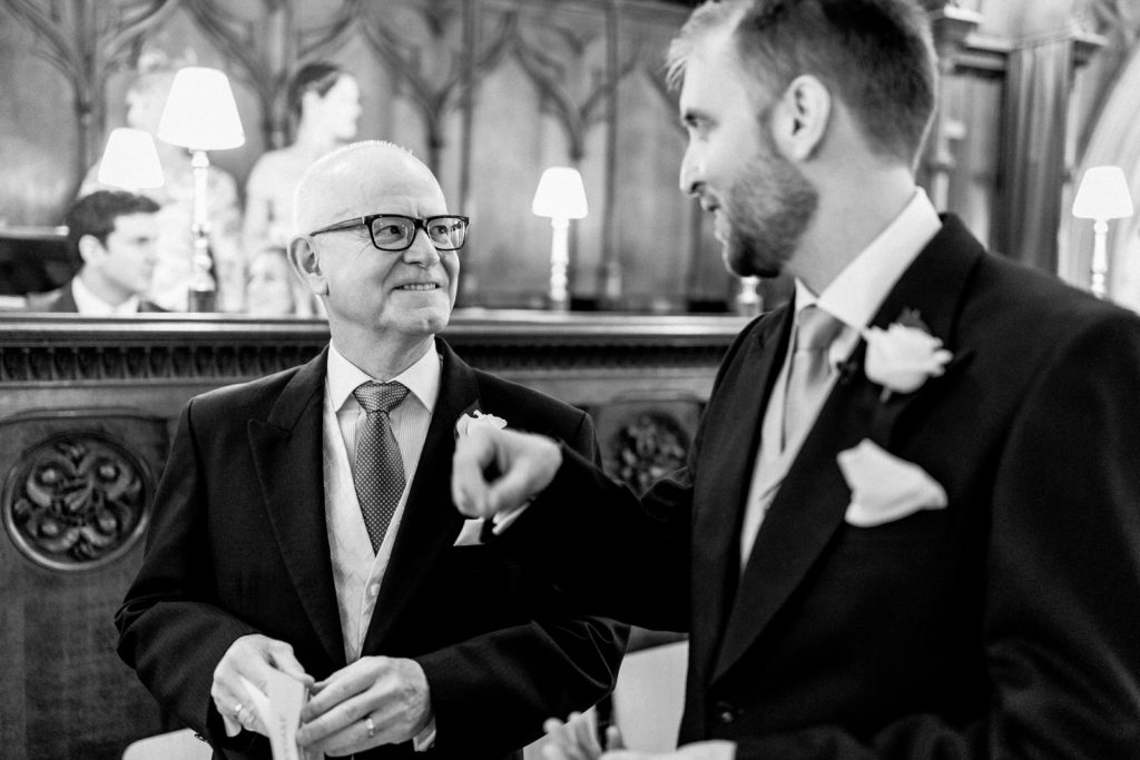 father and son at chichester catherdral on wedding day