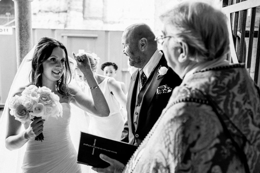 bride arriving at chichester cathedral wedding
