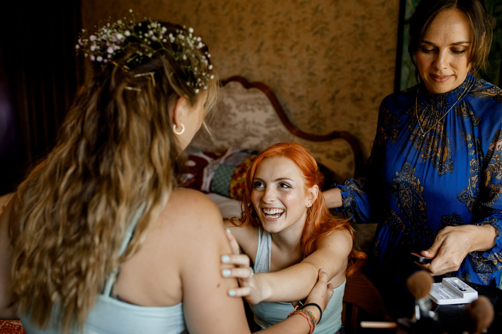 bride hugging bridesmaids