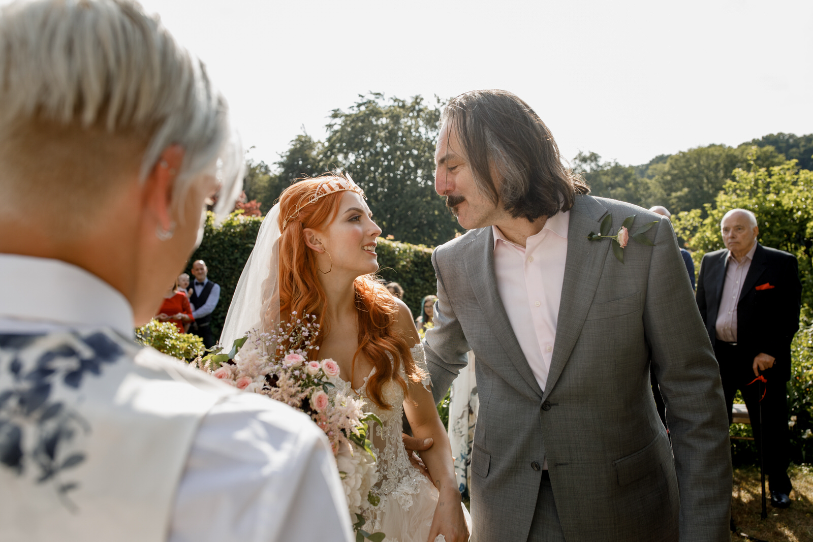 father giving bride away