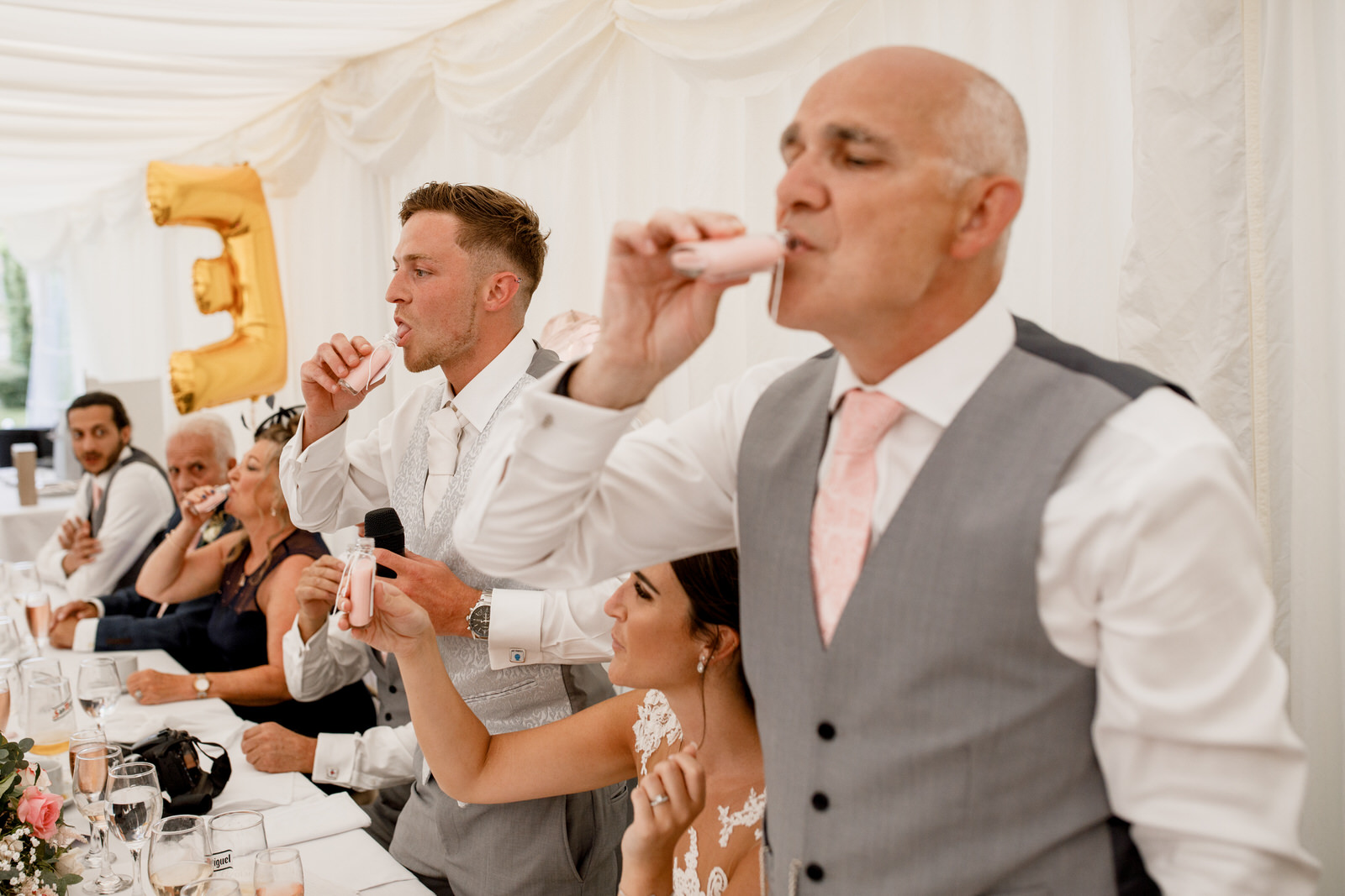 groom downing a shot