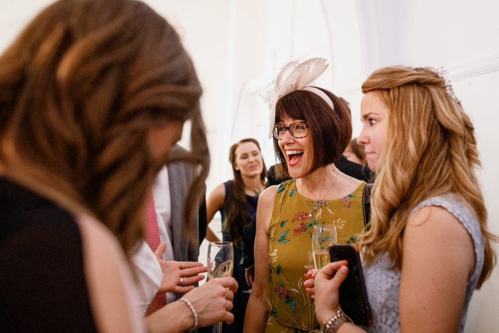 guests laughing at wedding reception