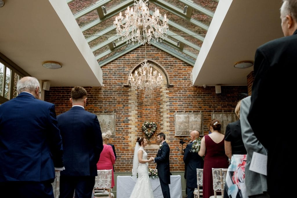 bride and groom in conservatory at offley place