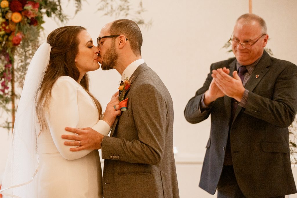 bride and groom first kiss at stoke place