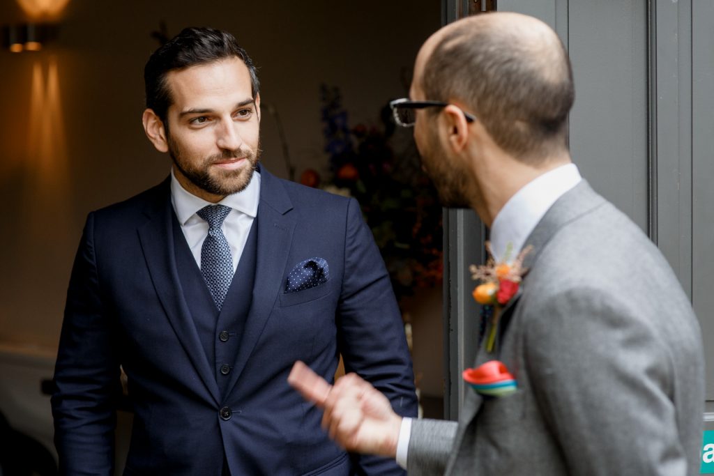 groom and best man chatting at stoke place wedding