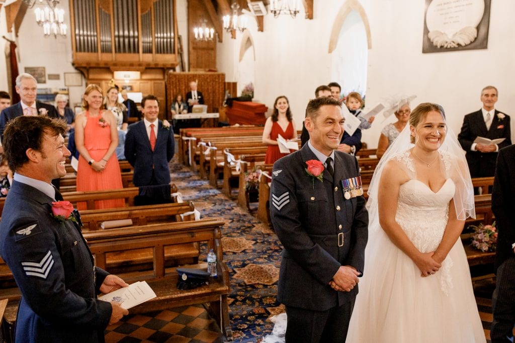 military bride and groom at altar