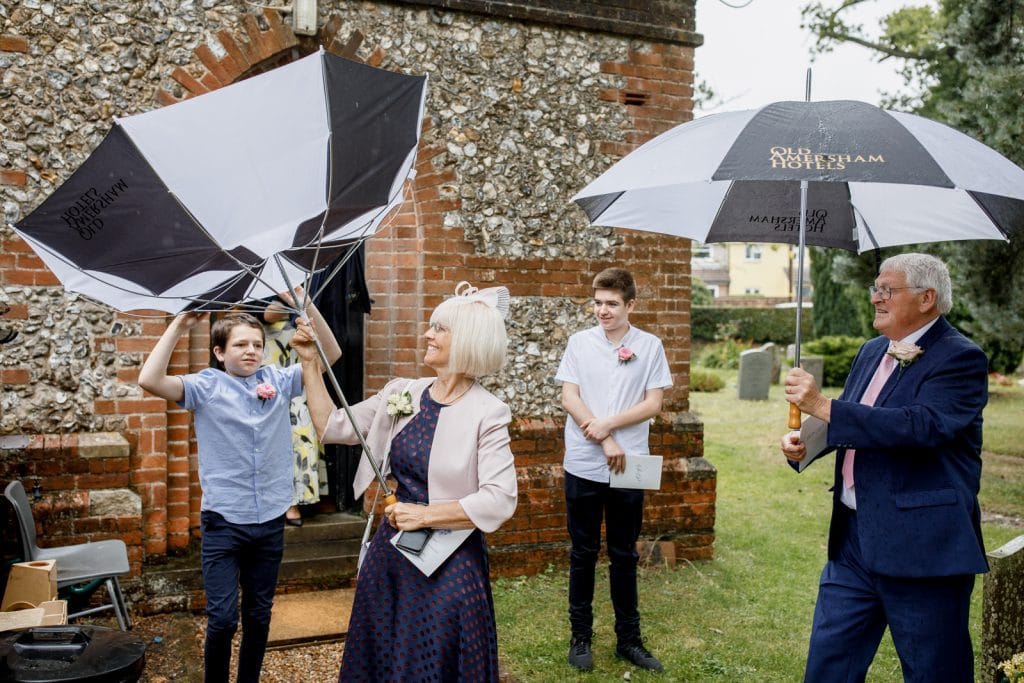 umbrella blowing inside out at wedding