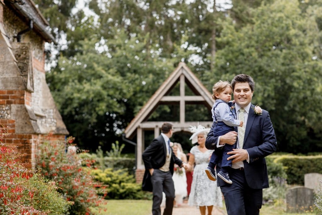 guests arriving at all saints church wedding