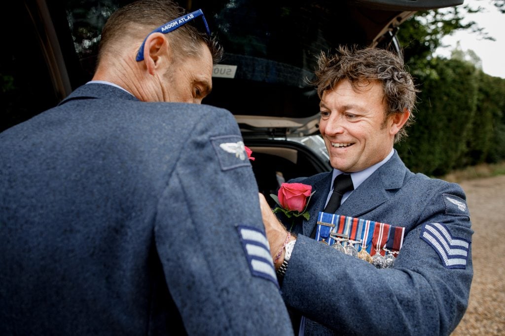 military wedding grooms going through prep