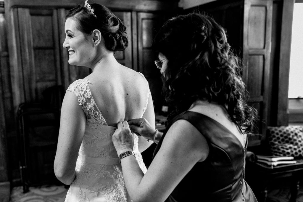 mother doing brides dress up