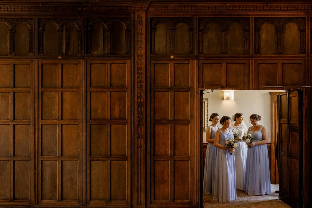bride waiting with bridesmaids at the long gallery room