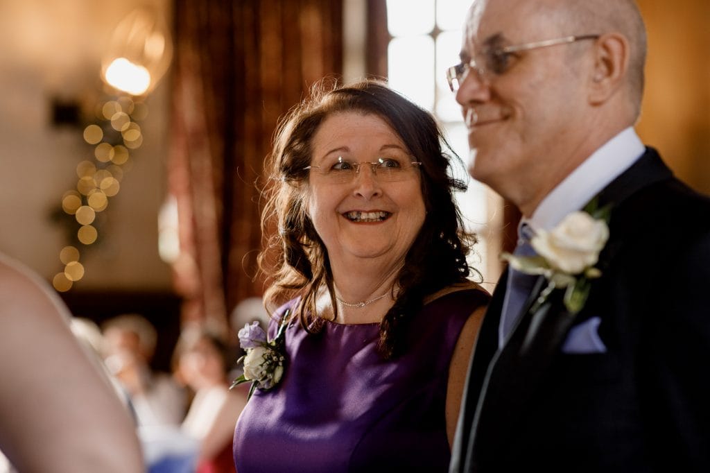 parents smiling at wedding