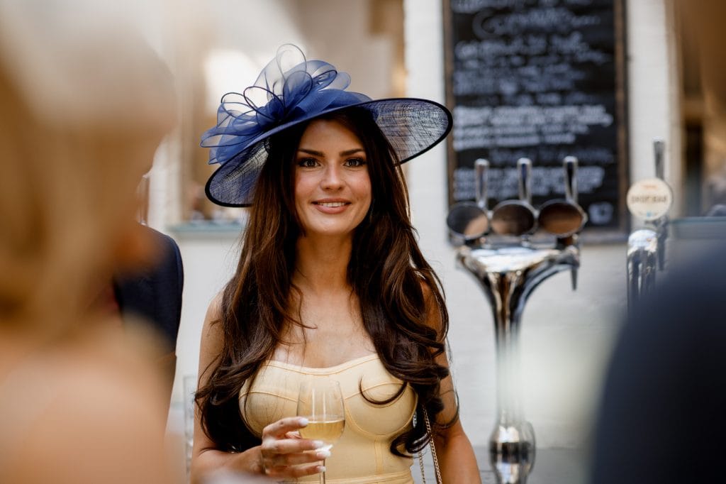 guest drinking at fanhams hall wedding