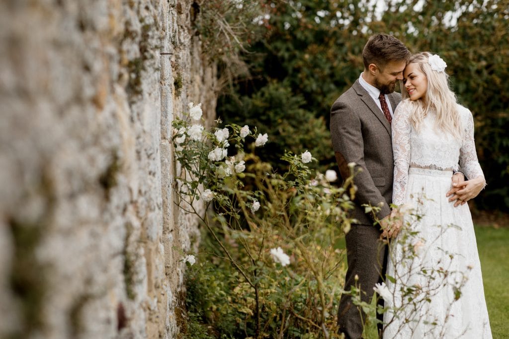 bride and groom in walled garden at notley abbey