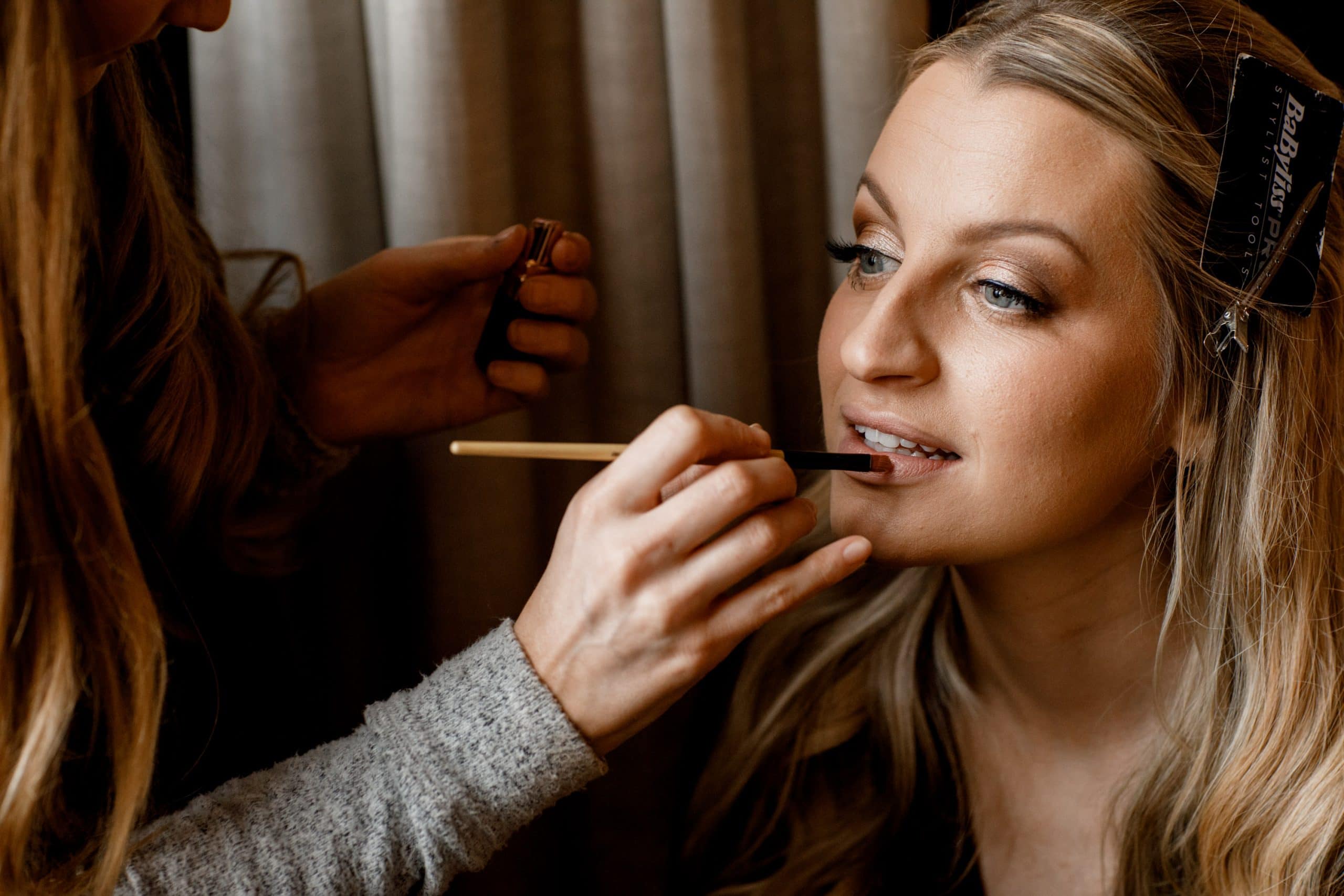 bride having lipstick applied