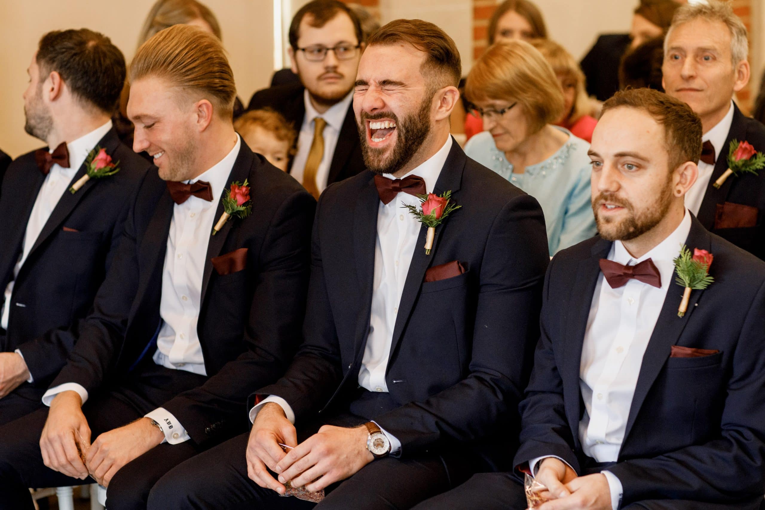 best man laughing at ceremony