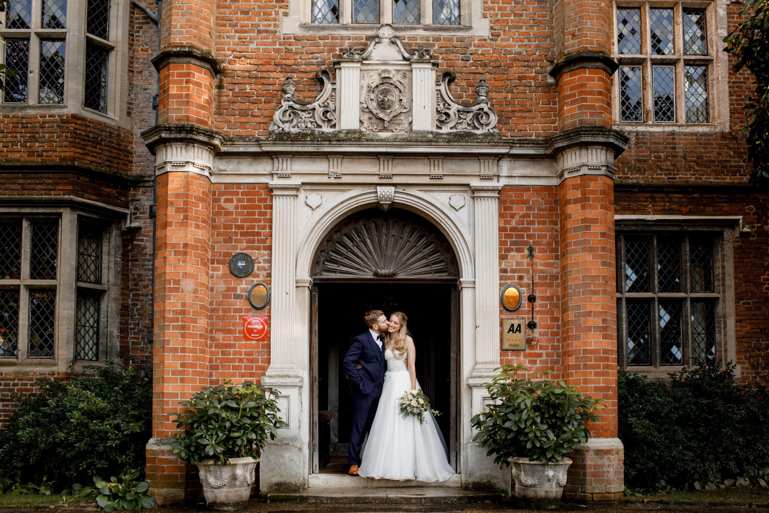 bride and groom outside great fosters