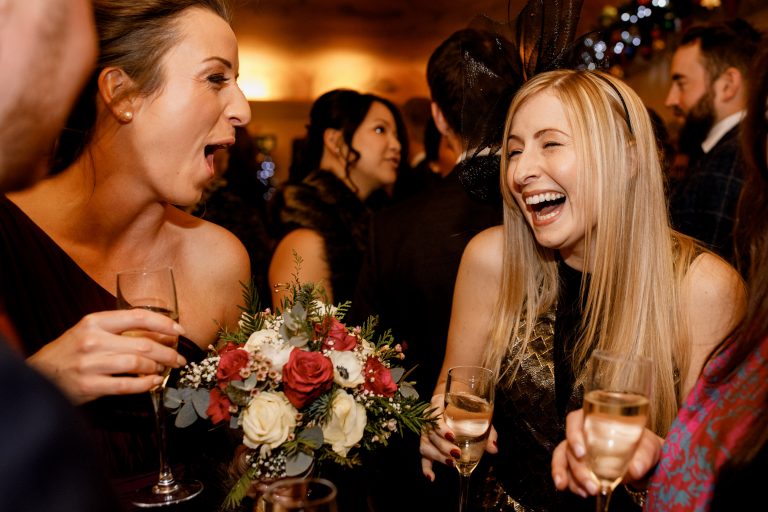 guests laughing at great fosters wedding
