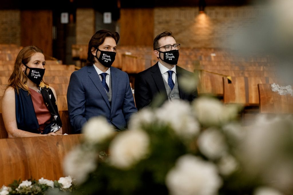guests wearing masks at covid-19 wedding