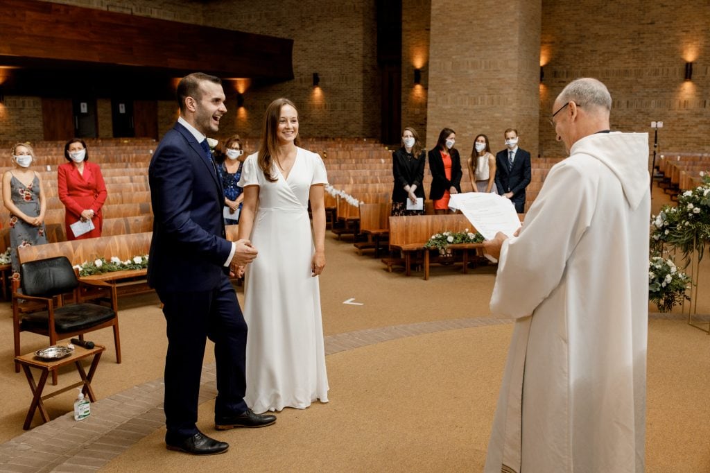 bride and groom laughing at wedding reception