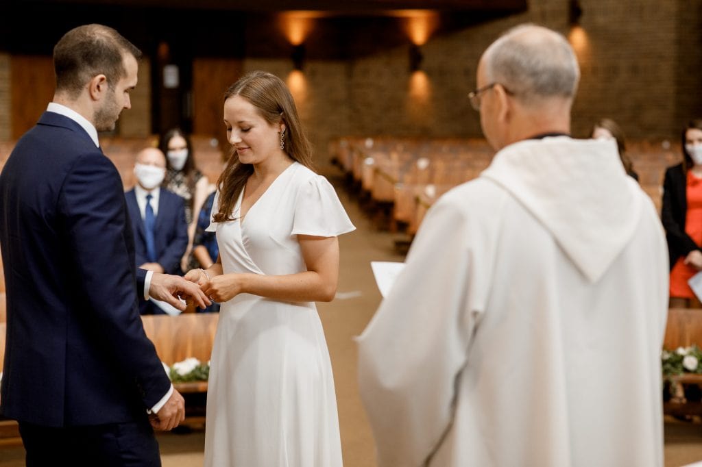 exchanging of the rings at covid-19 wedding ceremony