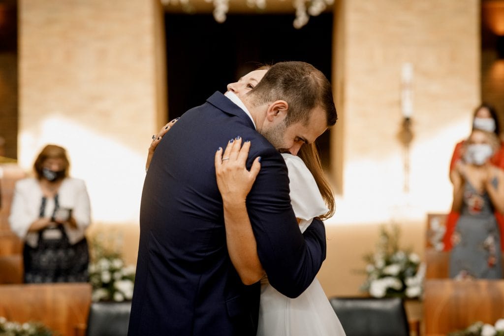 couple embracing at covid wedding