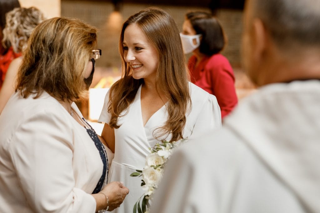 mother of the groom and bride smiling