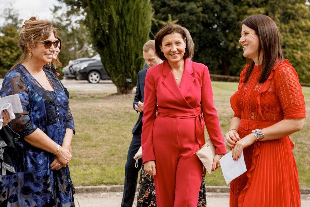 guests social distancing at covid wedding