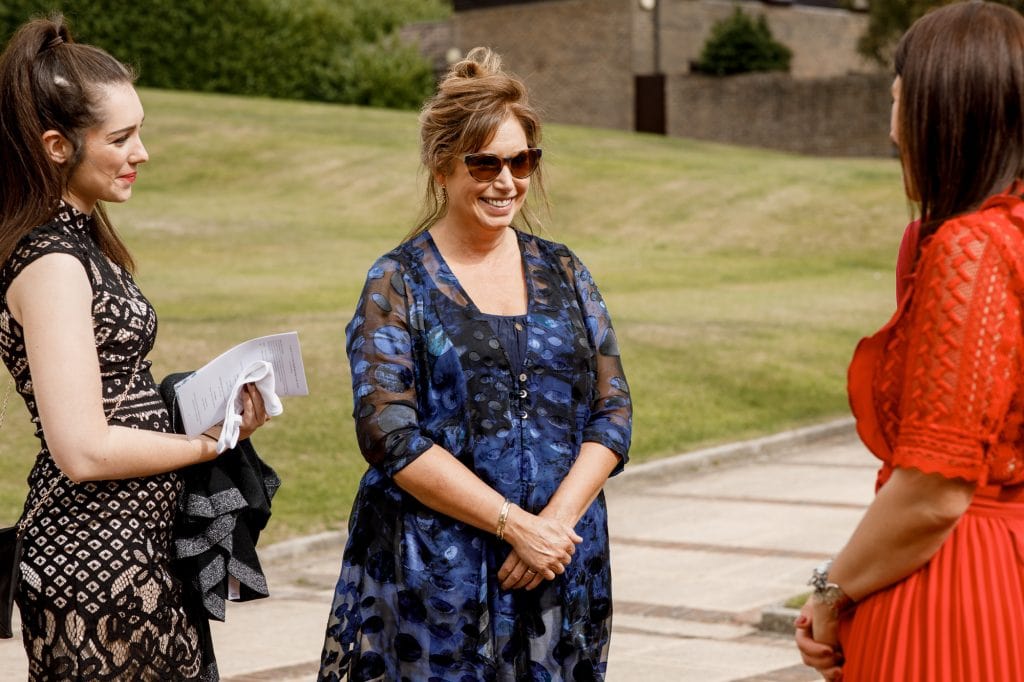 guests laughing at wedidng