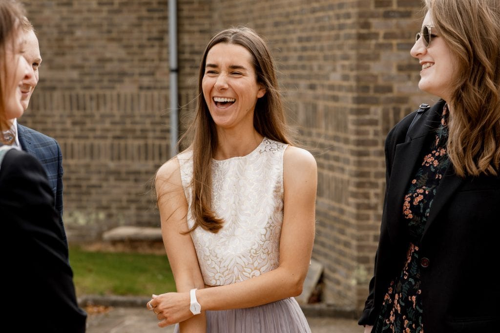 guest laughing at wedding