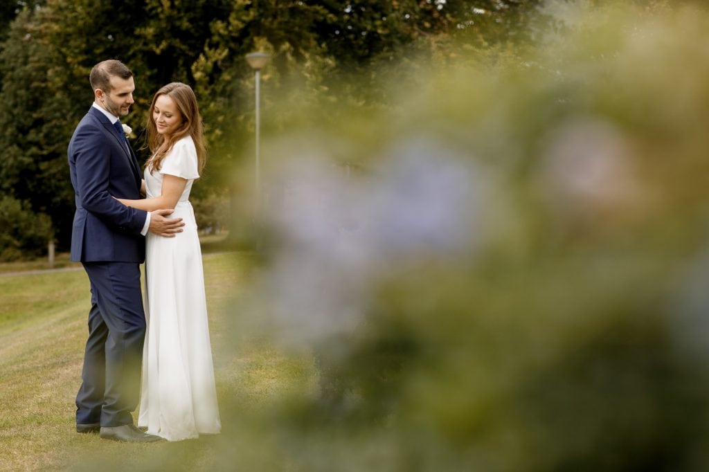 bride and groom holding hands