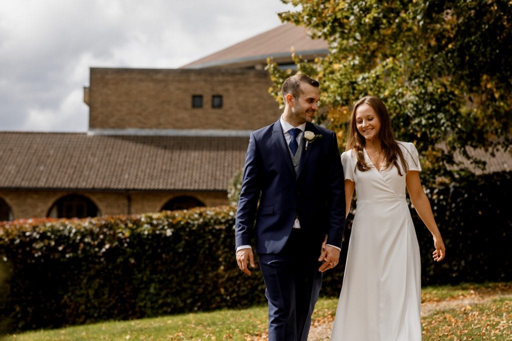 bride and groom laughing during portraits