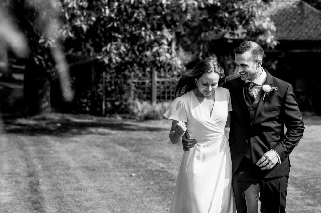 bride and groom walking away from church
