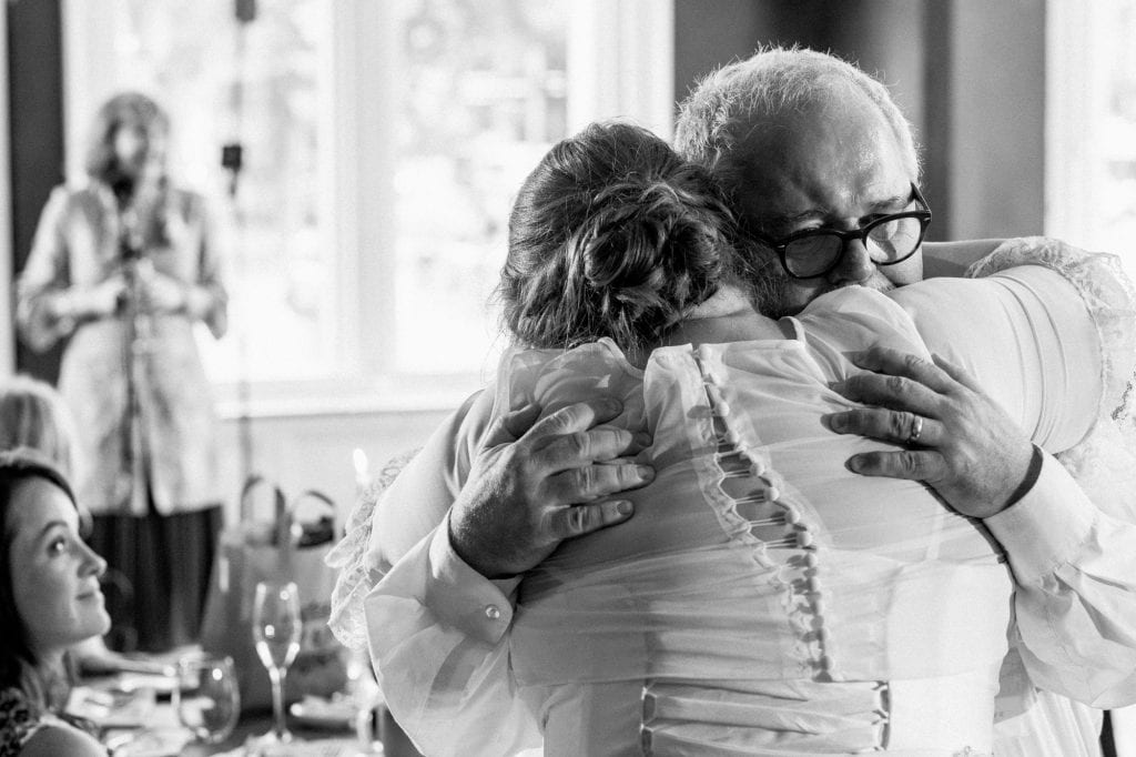 father and bride hugging at the randolph hotel wedding