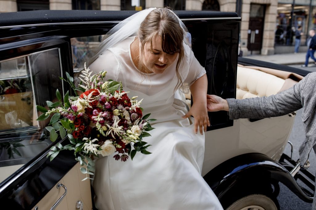 bride arriving in antique car