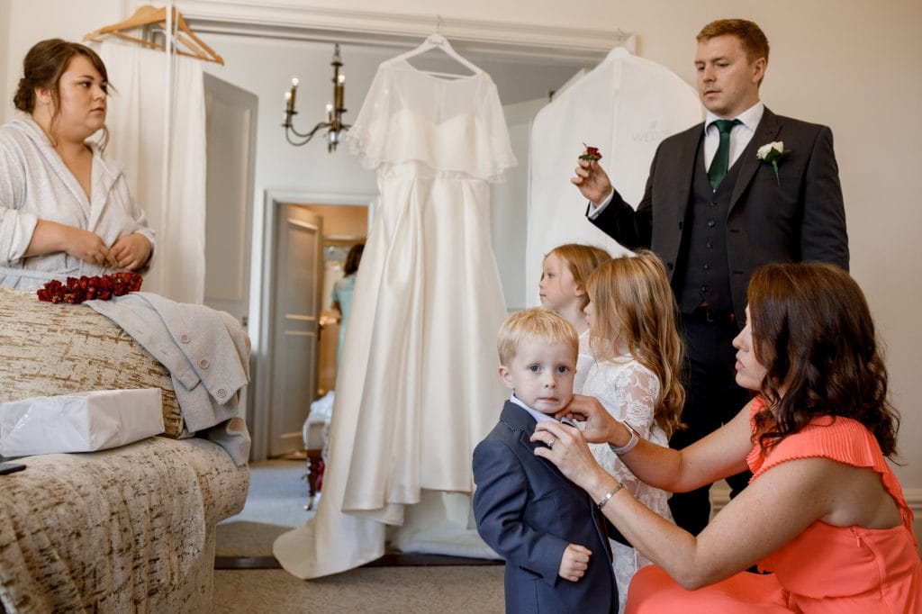 page boy pulling a face at oxford wedding